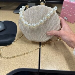 Elegant Pearl-Embellished Shell Clutch